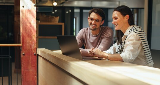 Business professionals joining an online conference in a coworking office